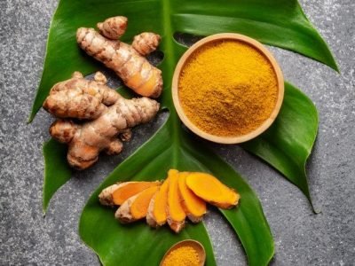 Premium Photo _ Turmeric powder and fresh turmeric root on grey Premium Photo _ Turmeric powder and fresh turmeric root on grey